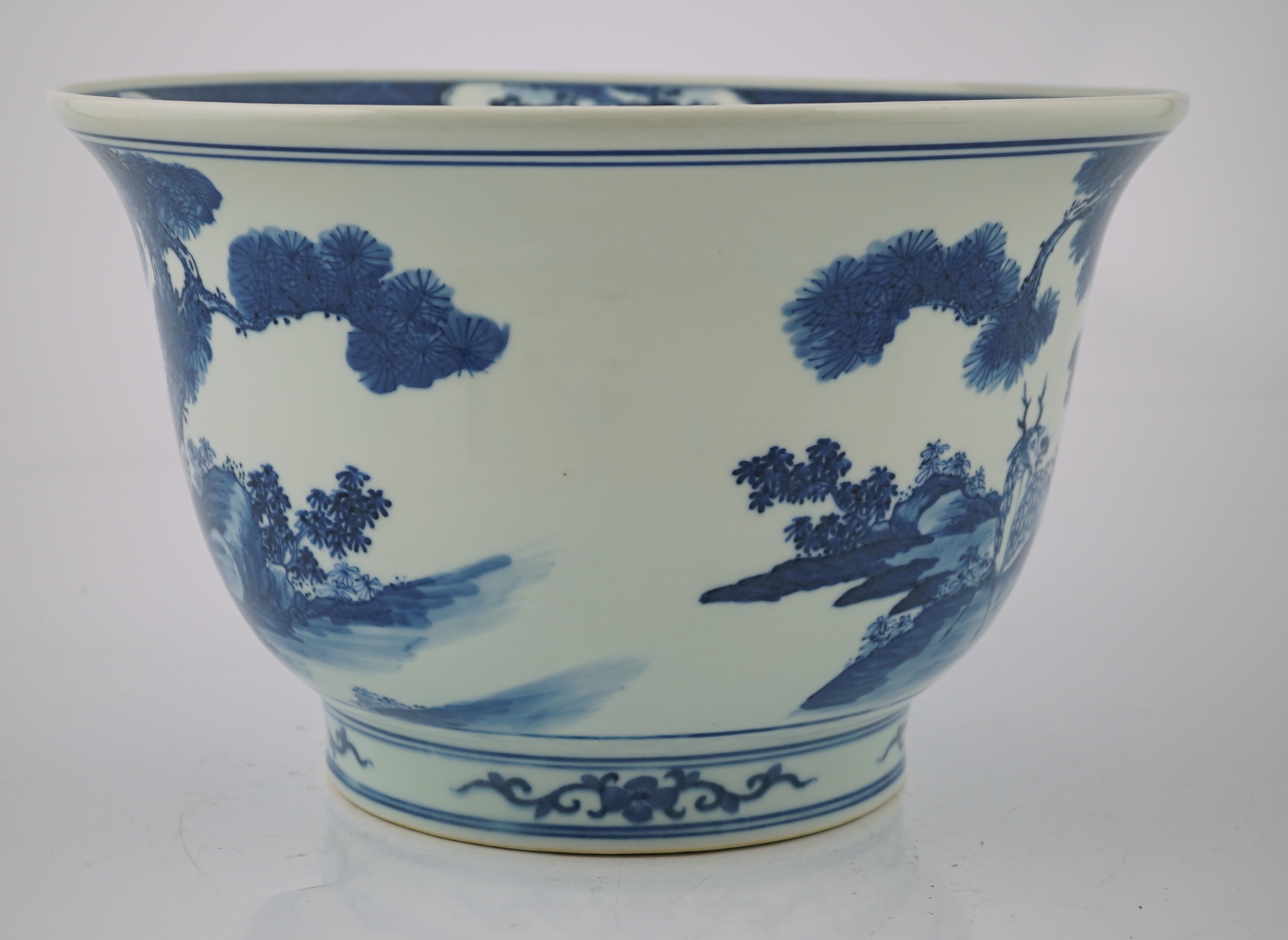 A Chinese blue and white 'deer and cranes' planter, 19th century, restoration to rim and a crack to the base